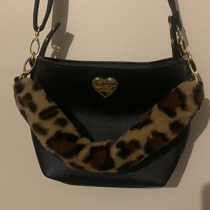 Black purse with faux fur handle